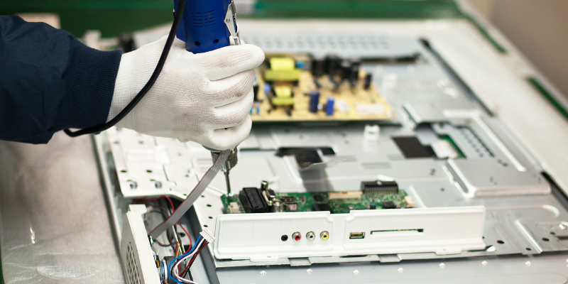 Man working on circuit board