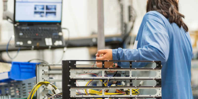 Man working on industrial electronics manufacturing