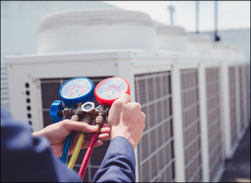 Technician is checking an air conditioner