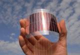 image of solar panel on someones hand