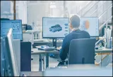 Industrial Engineer Working on Desktop Computer