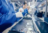 Technician assembling motherboard