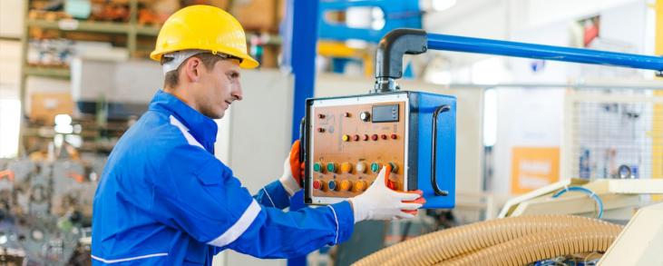 Man working on assembly line controller